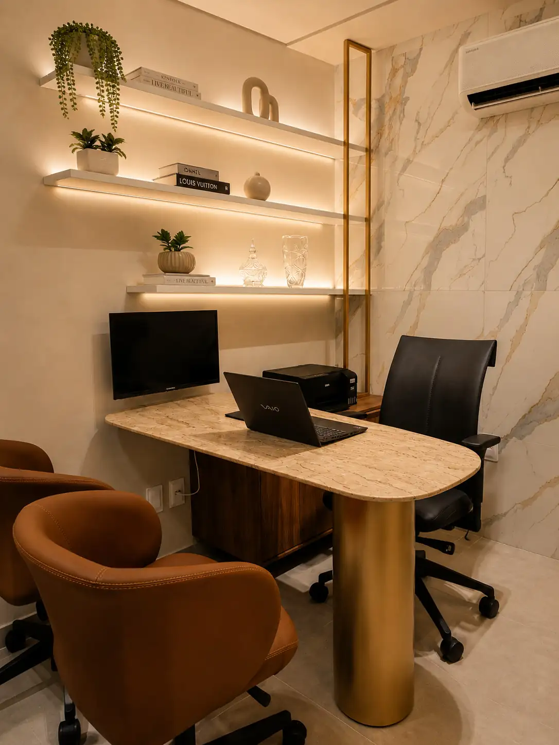 Segundo consultório de atendimento, com mesa de pedra e revestimento em mármore